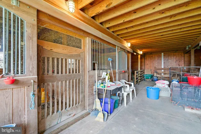a view of a patio with table and chairs and a potted plant