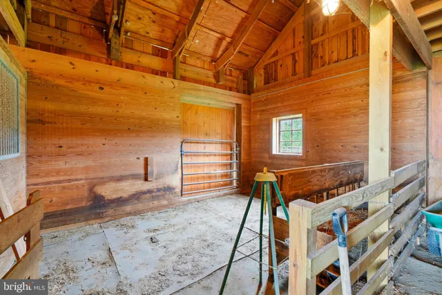 a view of a balcony with wooden floor and seating space