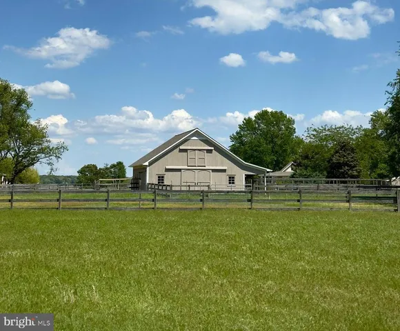 a view of a house with a big yard