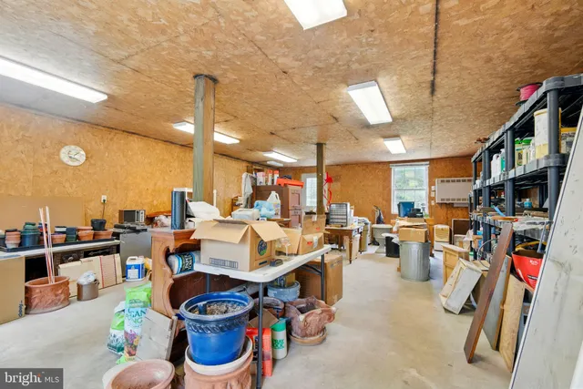 a living room with lots of furniture and gym equipment