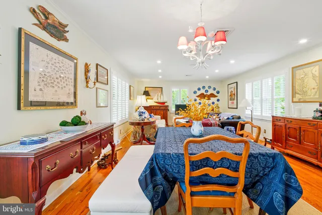 a very nice looking living room with furniture and a chandelier