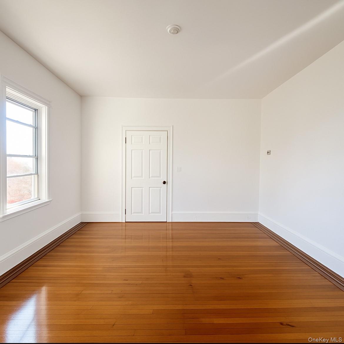 194 Summit Avenue, Unit 2 Mount Vernon, NY 10550 - Photo 9 of 19 Spare room with baseboards and wood-type flooring