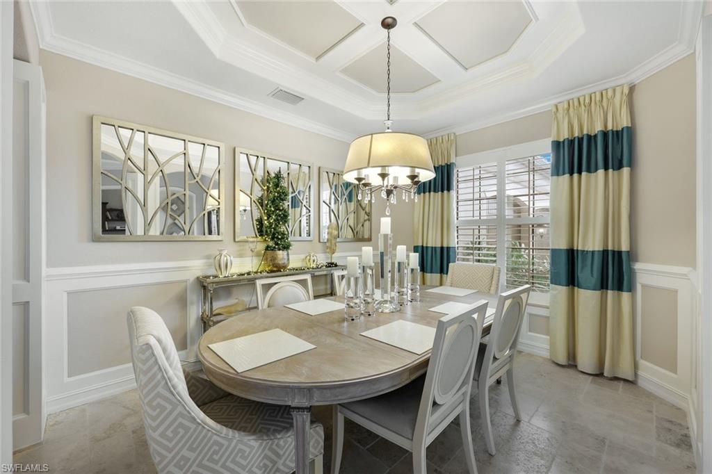 9856 Corso Bello Drive Naples, FL 34113 - Photo 12 of 50 a view of a dining room with furniture window and chandelier
