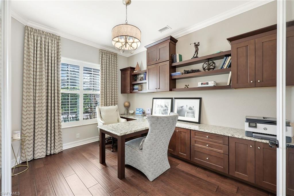 9856 Corso Bello Drive Naples, FL 34113 - Photo 13 of 50 a view of a kitchen with workspace and wooden floor