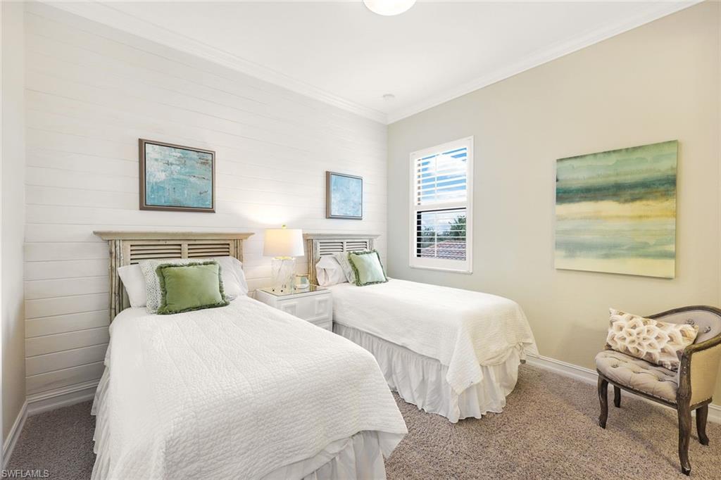 9856 Corso Bello Drive Naples, FL 34113 - Photo 19 of 50 a bedroom with two beds and a couch