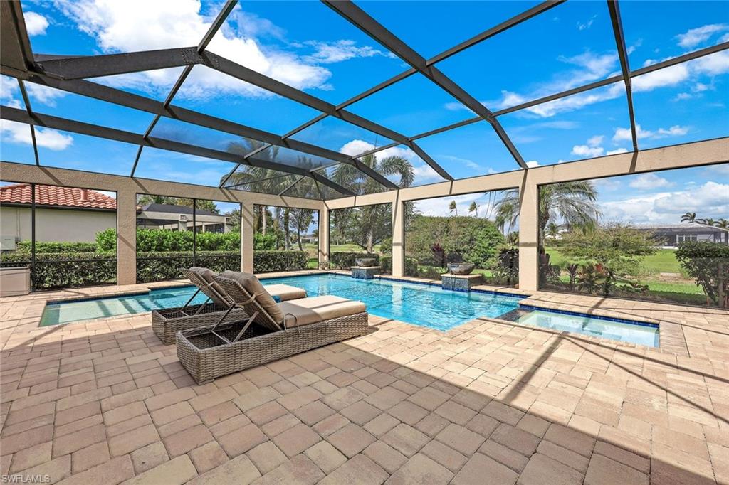 9856 Corso Bello Drive Naples, FL 34113 - Photo 2 of 50 a view of swimming pool with couch and chairs