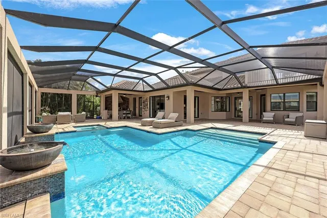 a view of a swimming pool with a patio