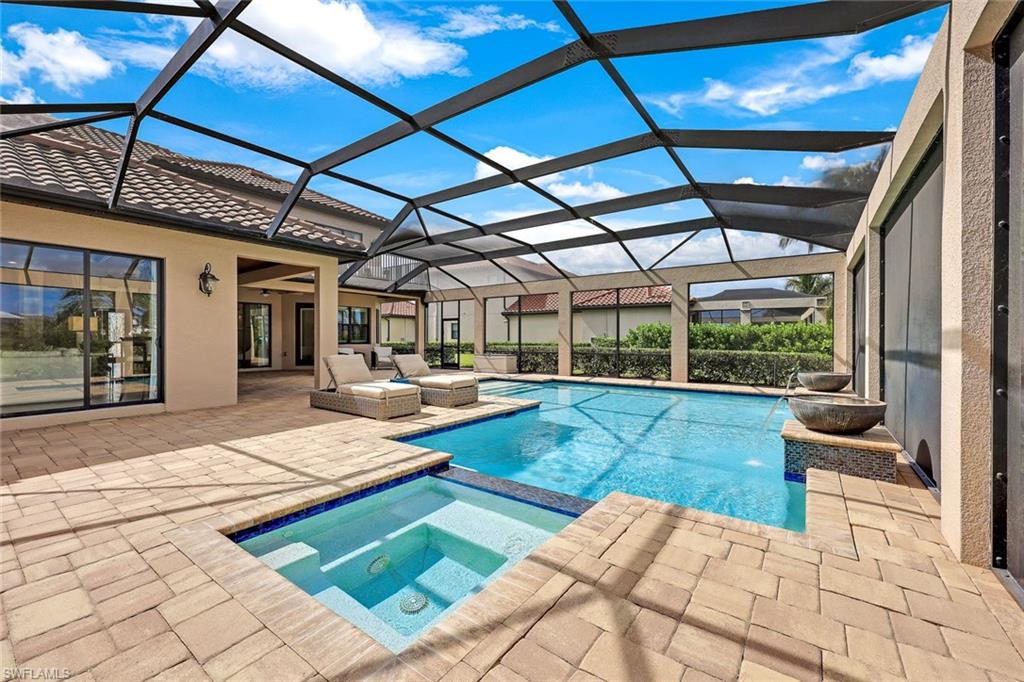 9856 Corso Bello Drive Naples, FL 34113 - Photo 28 of 50 a view of swimming pool with seating area and furniture
