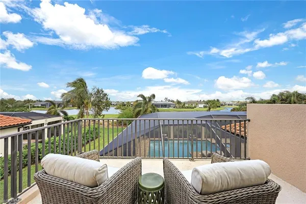 a view of a balcony with furniture