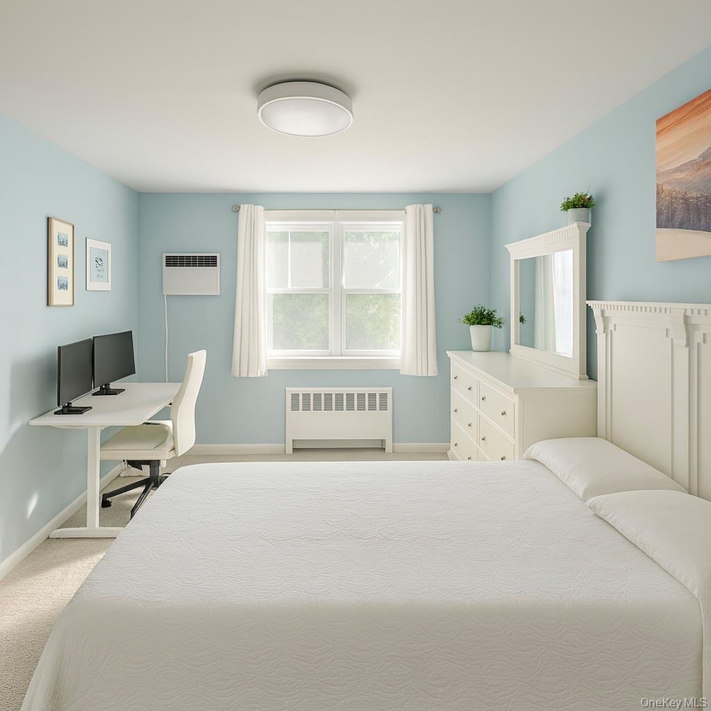 150-40 Jewel Avenue, Unit 66B Queens, NY 11367 - Photo 10 of 11 a bedroom with a bed and a large window