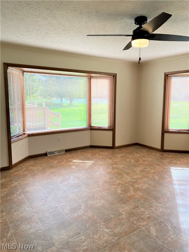 7682 Sanborn Road Ashtabula, OH 44004 - Photo 9 of 35 Dining area off the kitchen with loads of windows for beautiful light. 15 x 15