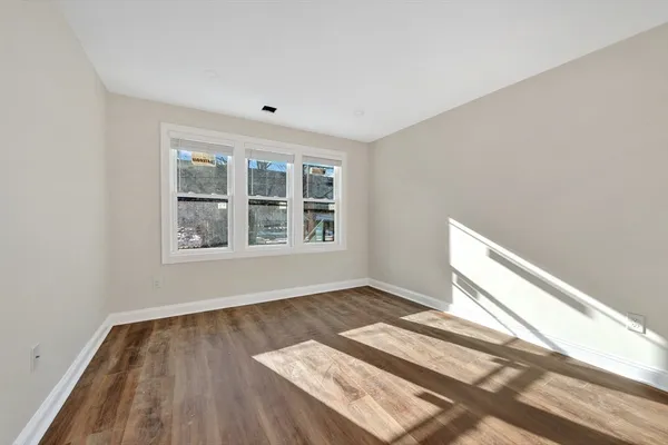 a large kitchen with stainless steel appliances a stove a sink dishwasher and a refrigerator