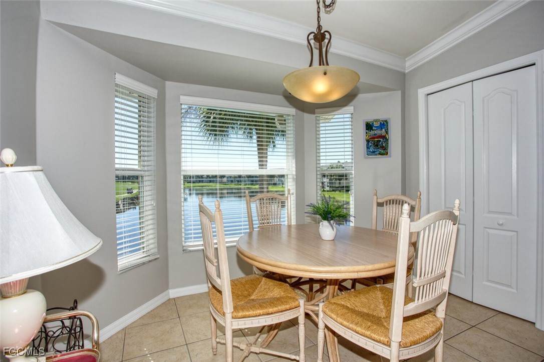 10371 McArthur Palms Lane, Unit 2823 Fort Myers, FL 33966 - Photo 12 of 48 a view of a dining room with furniture and window