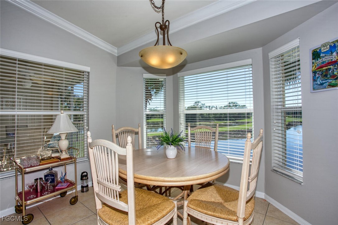 10371 McArthur Palms Lane, Unit 2823 Fort Myers, FL 33966 - Photo 14 of 48 a view of a dining room with furniture and window