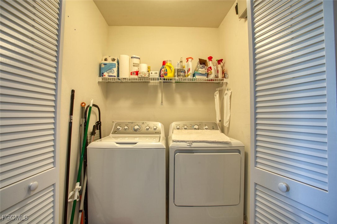 10371 McArthur Palms Lane, Unit 2823 Fort Myers, FL 33966 - Photo 21 of 48 a utility room with dryer and washer