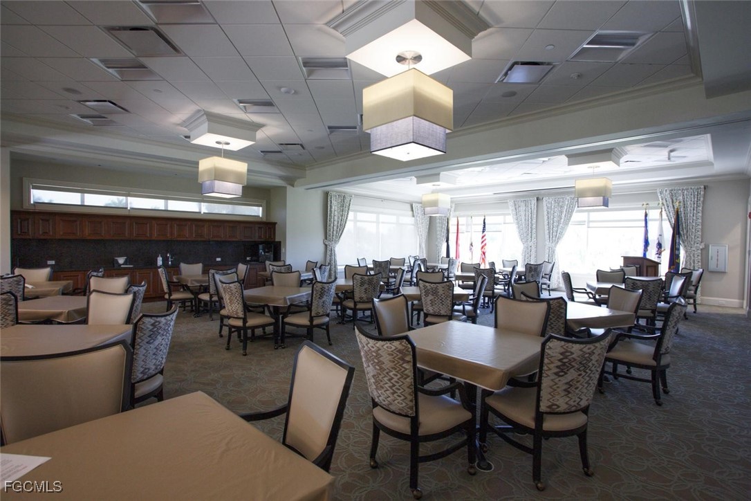 10371 McArthur Palms Lane, Unit 2823 Fort Myers, FL 33966 - Photo 29 of 48 a view of a dining room with furniture