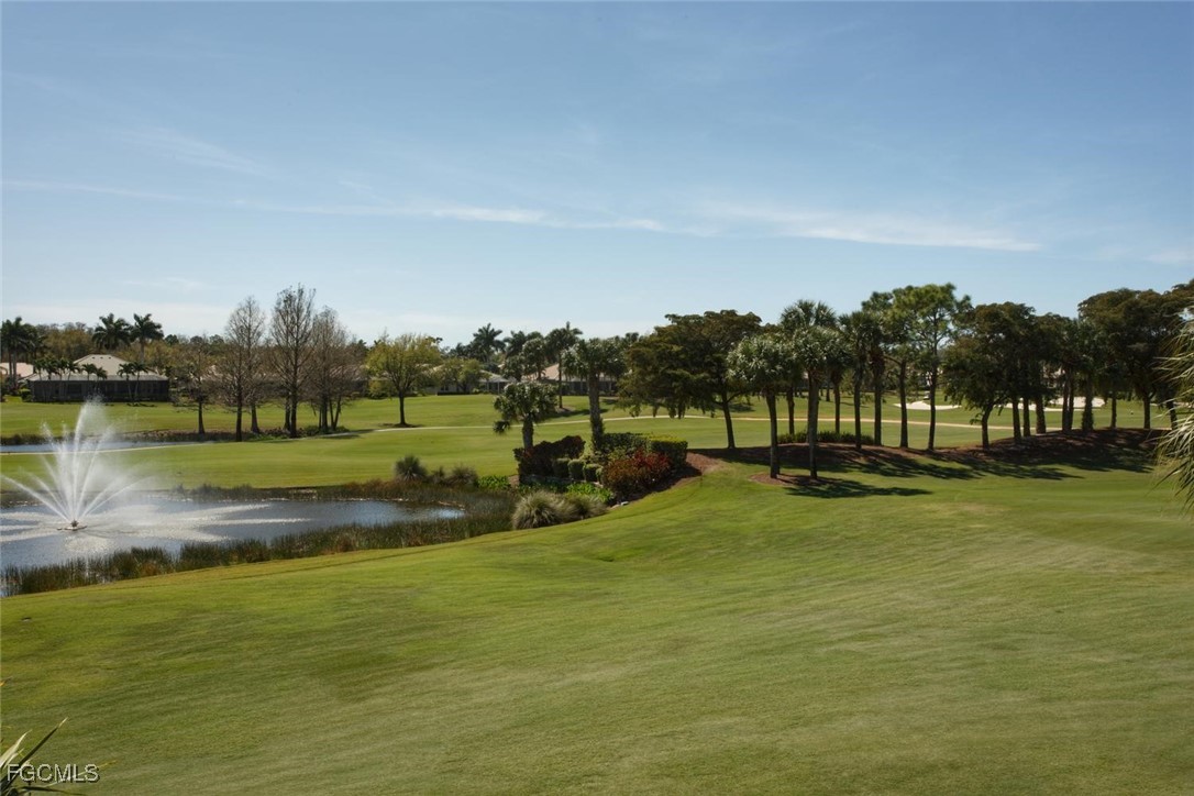 10371 McArthur Palms Lane, Unit 2823 Fort Myers, FL 33966 - Photo 34 of 48 a view of a golf course with a lake view