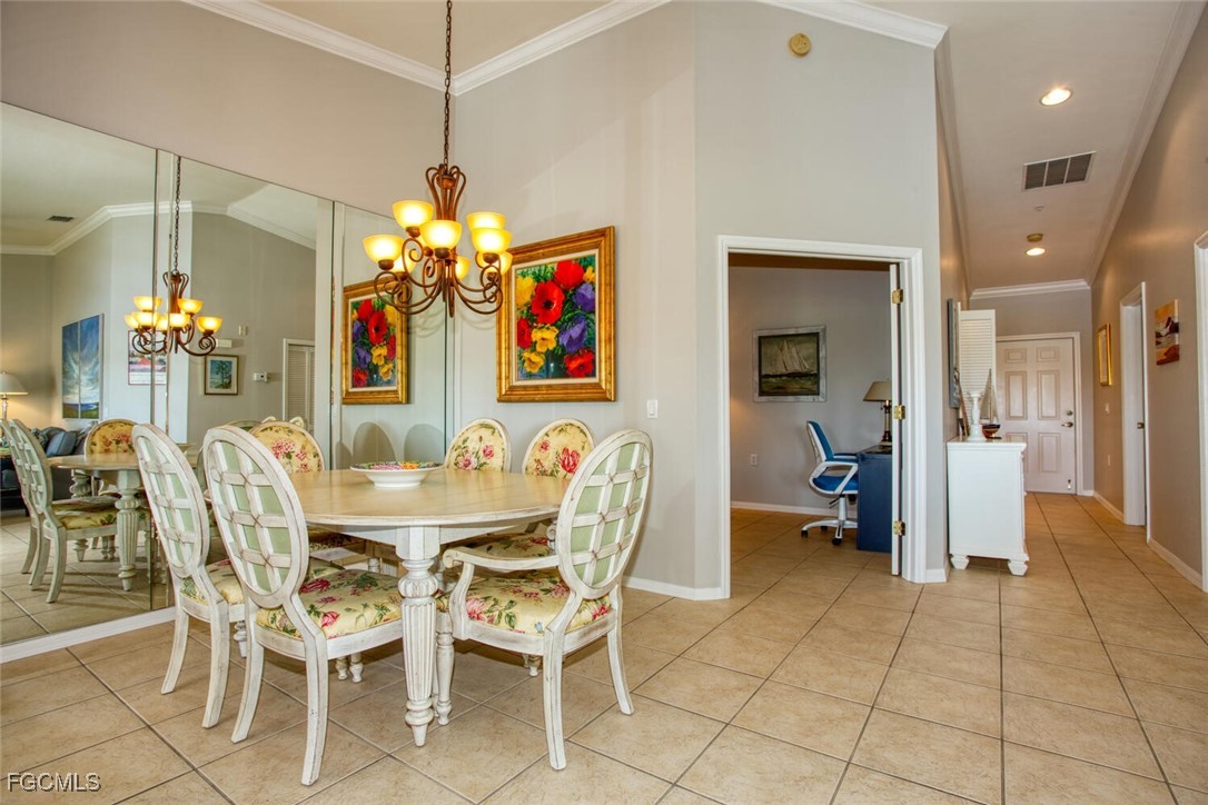 10371 McArthur Palms Lane, Unit 2823 Fort Myers, FL 33966 - Photo 8 of 48 a view of a dining room with furniture and chandelier