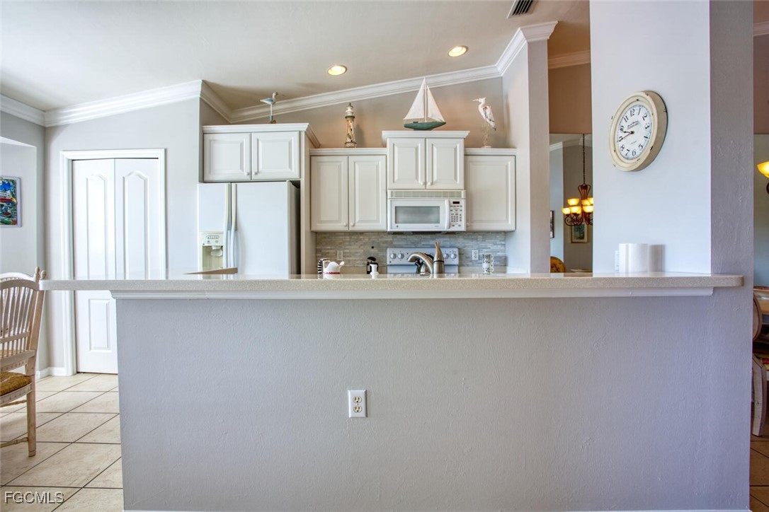 10371 McArthur Palms Lane, Unit 2823 Fort Myers, FL 33966 - Photo 9 of 48 a view of a kitchen with a window