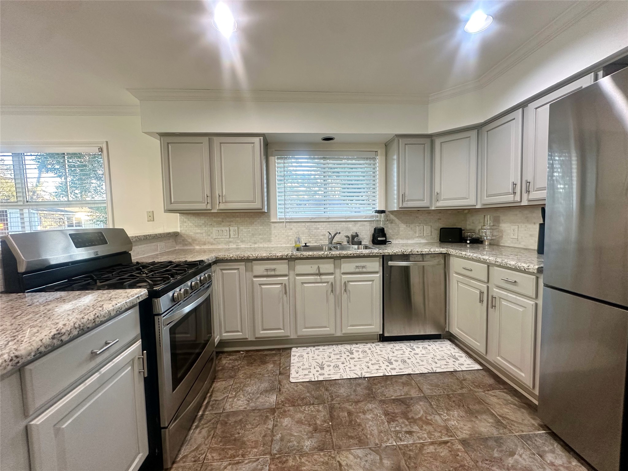 5329 Pagewood Lane Houston, TX 77056 - Photo 8 of 18 a kitchen with a stove top oven sink and cabinets