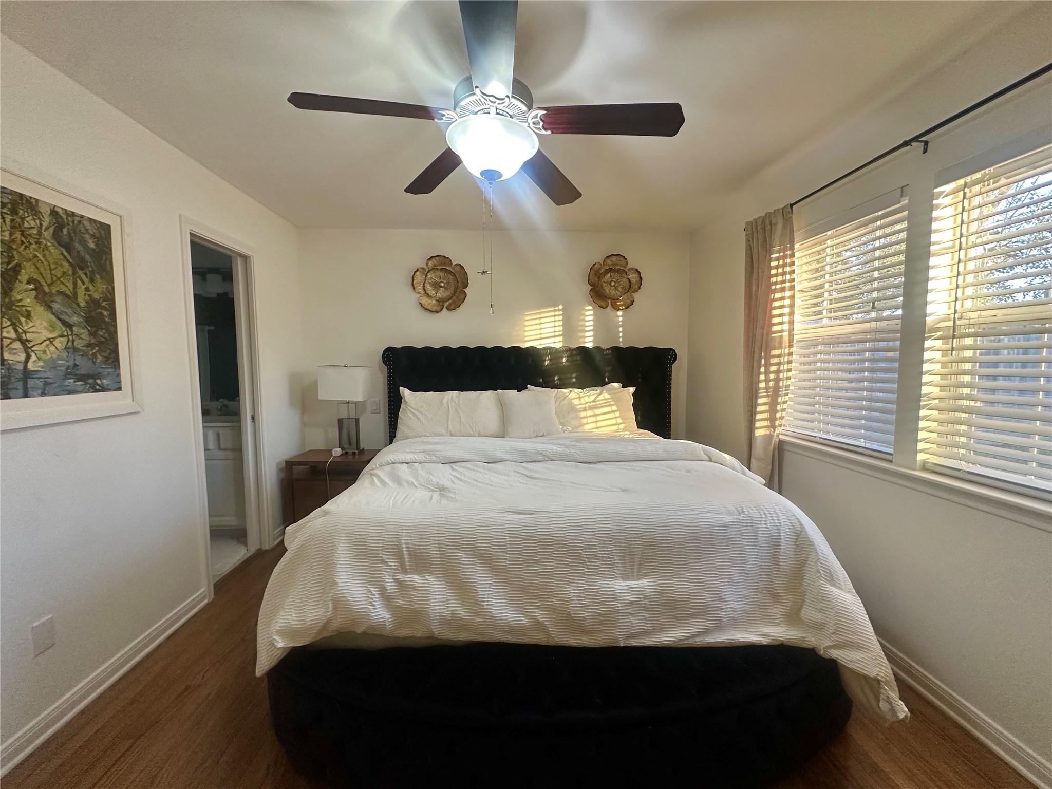5329 Pagewood Lane Houston, TX 77056 - Photo 10 of 18 a bedroom with a large bed and a window
