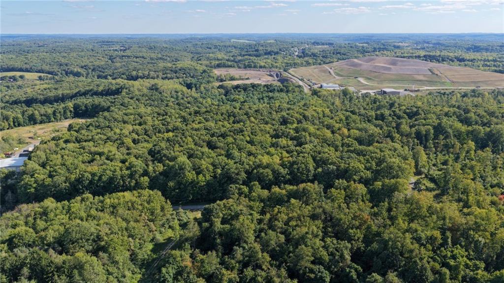 0 Kuzma Road West Sunbury, PA 16061 - Photo 2 of 13 an aerial view of residential houses with outdoor space and trees