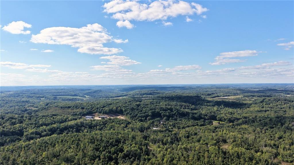 0 Kuzma Road West Sunbury, PA 16061 - Photo 8 of 13 an aerial view of houses covered in trees