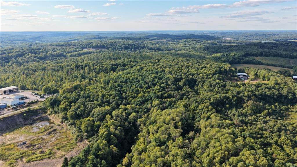 0 Kuzma Road West Sunbury, PA 16061 - Photo 9 of 13 a view of a city with lush green forest