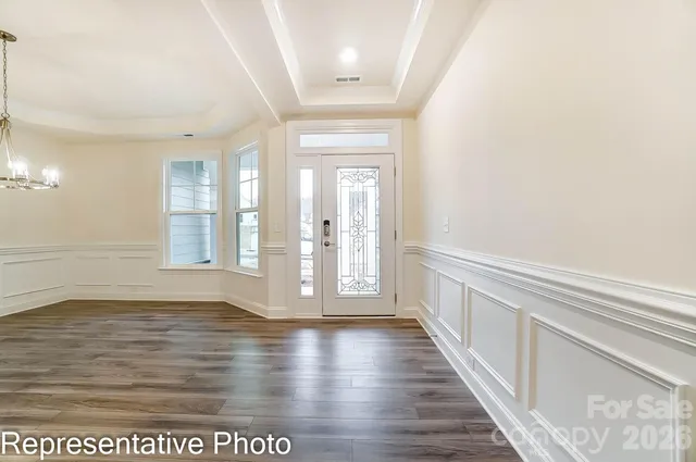 a view of an entryway with wooden floor
