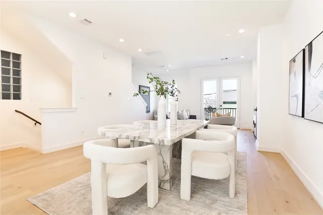 a dining room with furniture a chandelier and a table