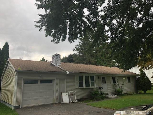 a front view of a house with garage