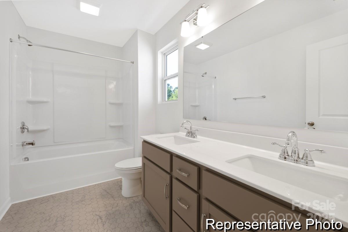 1015 Gondola Court, Unit 21AP Salisbury, NC 28146 - Photo 21 of 22 a bathroom with a sink double vanity granite toilet tub and shower