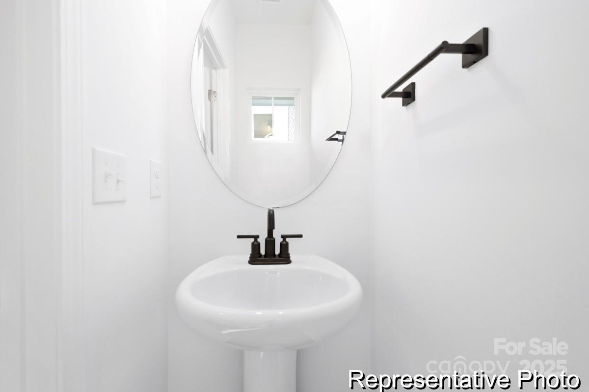 1015 Gondola Court, Unit 21AP Salisbury, NC 28146 - Photo 8 of 22 a bathroom with a sink and mirror