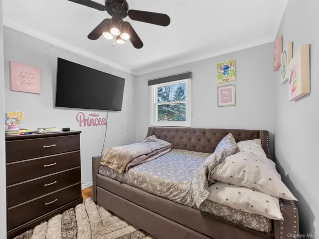 a bathroom with a granite countertop sink a toilet and a mirror