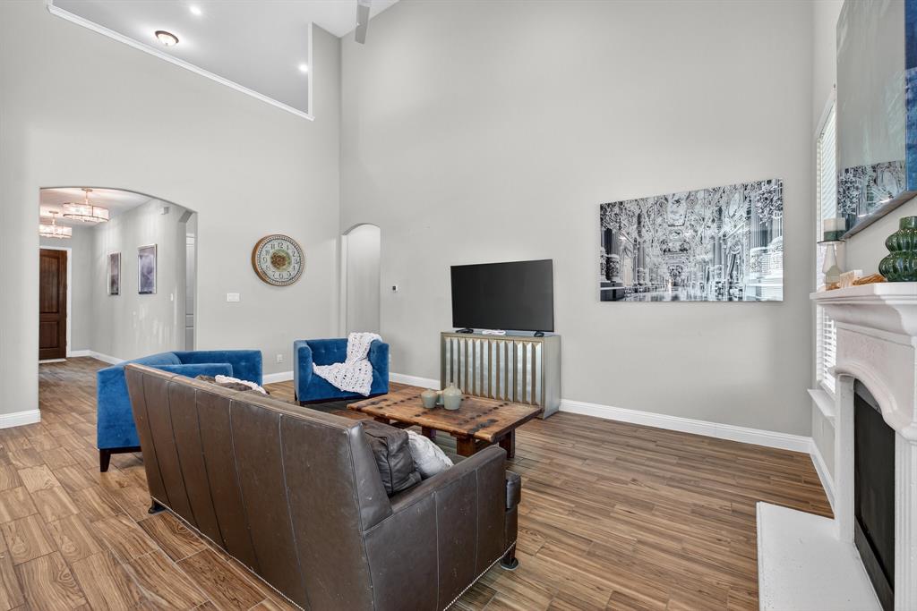 2815 Long Slope Road Arlington, TX 76001 - Photo 11 of 34 a living room with furniture and a flat screen tv