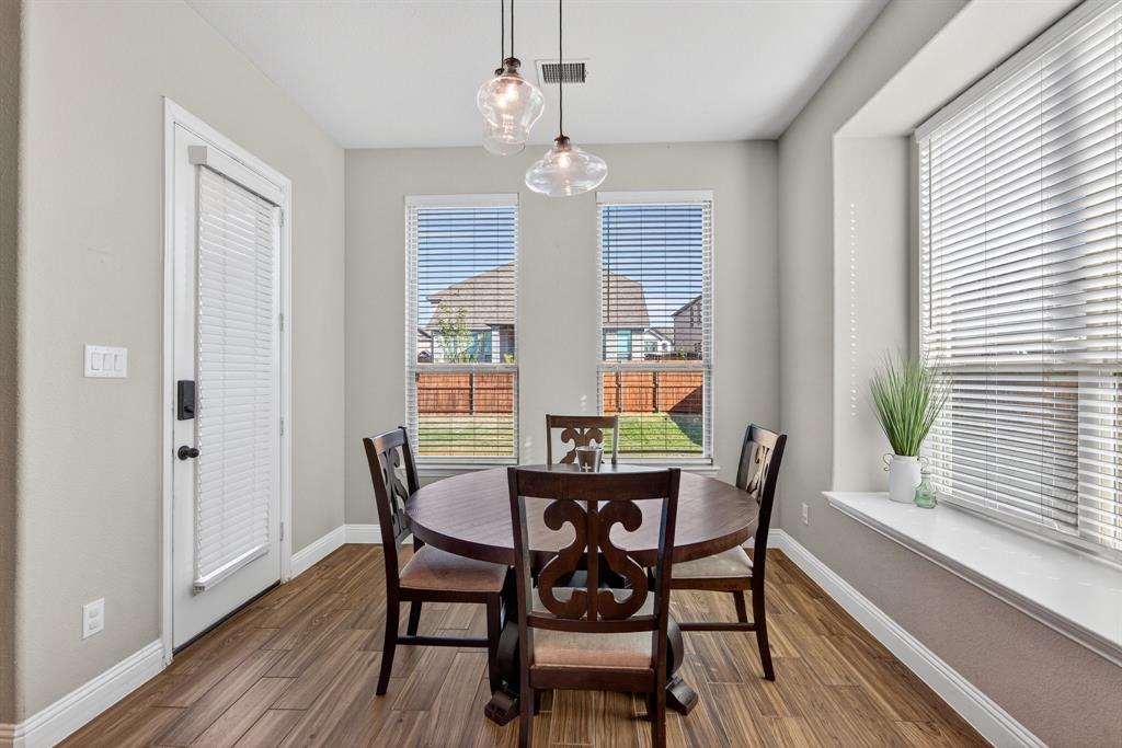 2815 Long Slope Road Arlington, TX 76001 - Photo 17 of 34 a view of a dining room with furniture window and wooden floor