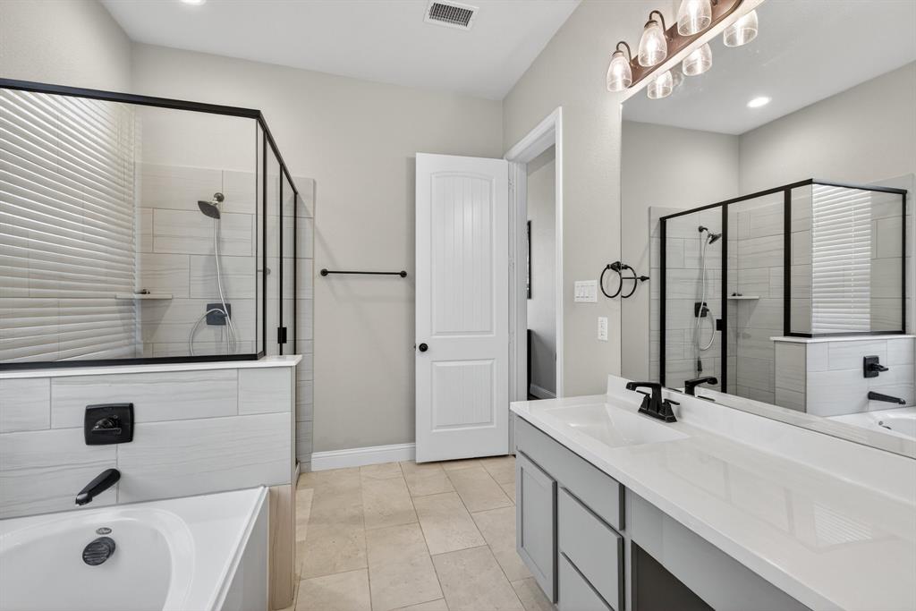 2815 Long Slope Road Arlington, TX 76001 - Photo 22 of 34 a bathroom with a double vanity sink mirror and double