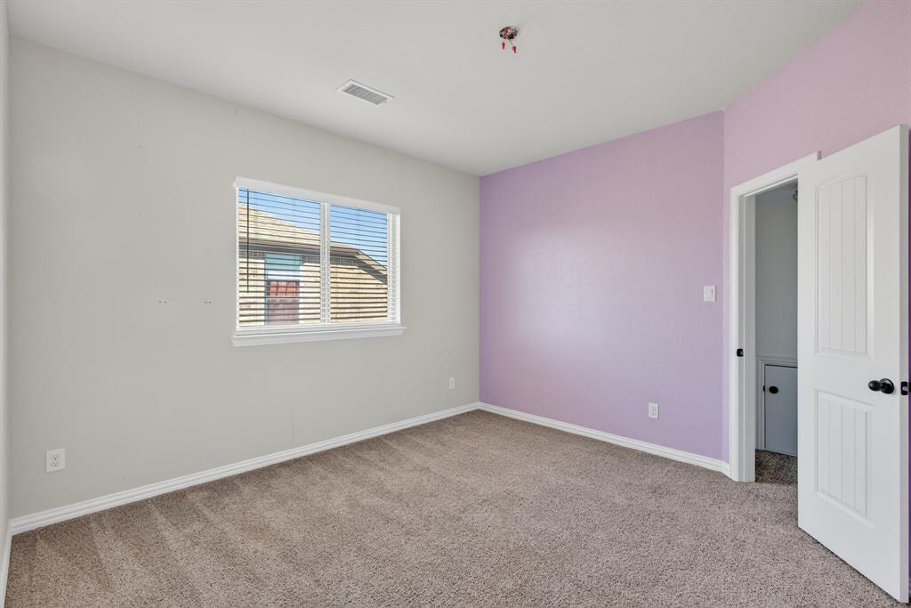 2815 Long Slope Road Arlington, TX 76001 - Photo 26 of 34 an empty room with windows