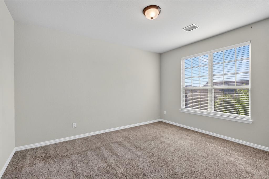 2815 Long Slope Road Arlington, TX 76001 - Photo 29 of 34 an empty room with a window