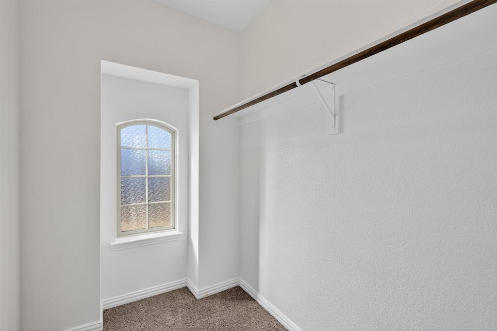 2815 Long Slope Road Arlington, TX 76001 - Photo 30 of 34 a view of a small space with wooden floor and a window