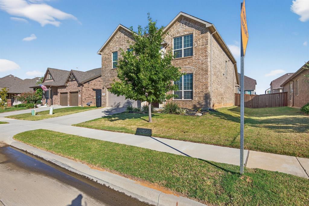 2815 Long Slope Road Arlington, TX 76001 - Photo 3 of 34 a front view of a house with garden