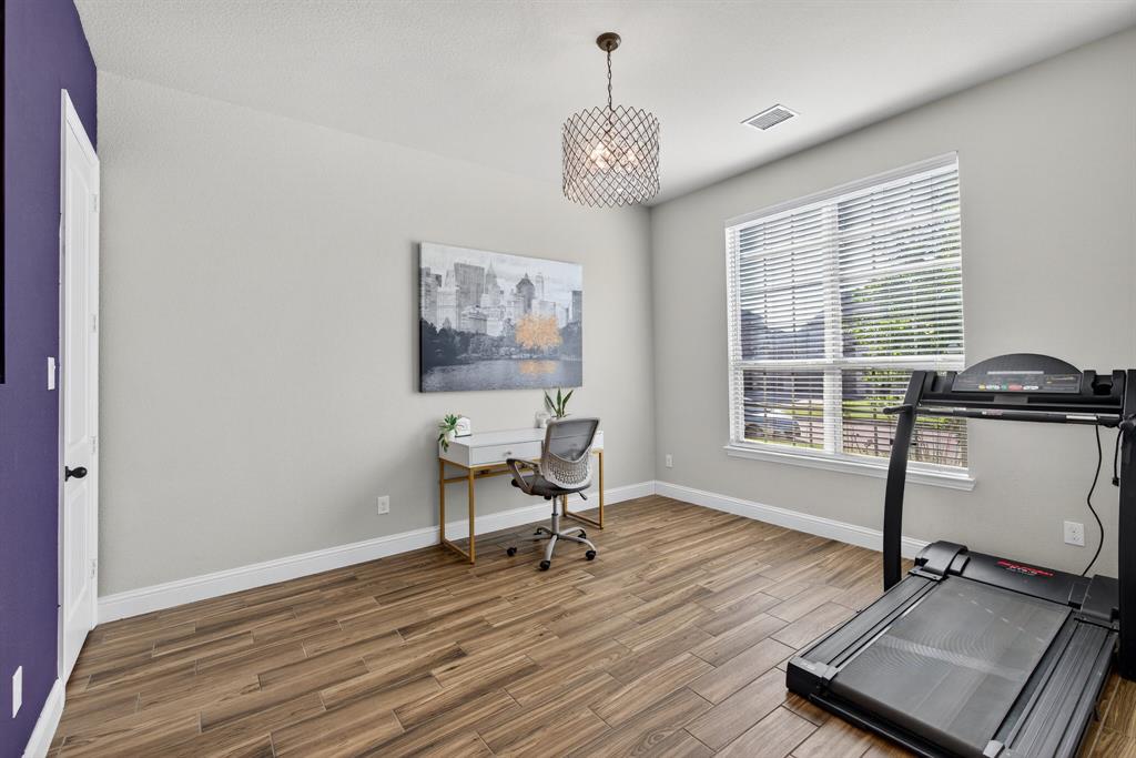 2815 Long Slope Road Arlington, TX 76001 - Photo 5 of 34 a view of a workspace with furniture and a window