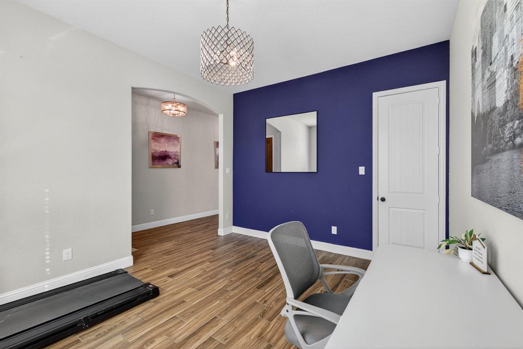 2815 Long Slope Road Arlington, TX 76001 - Photo 6 of 34 a workspace with furniture and chandelier
