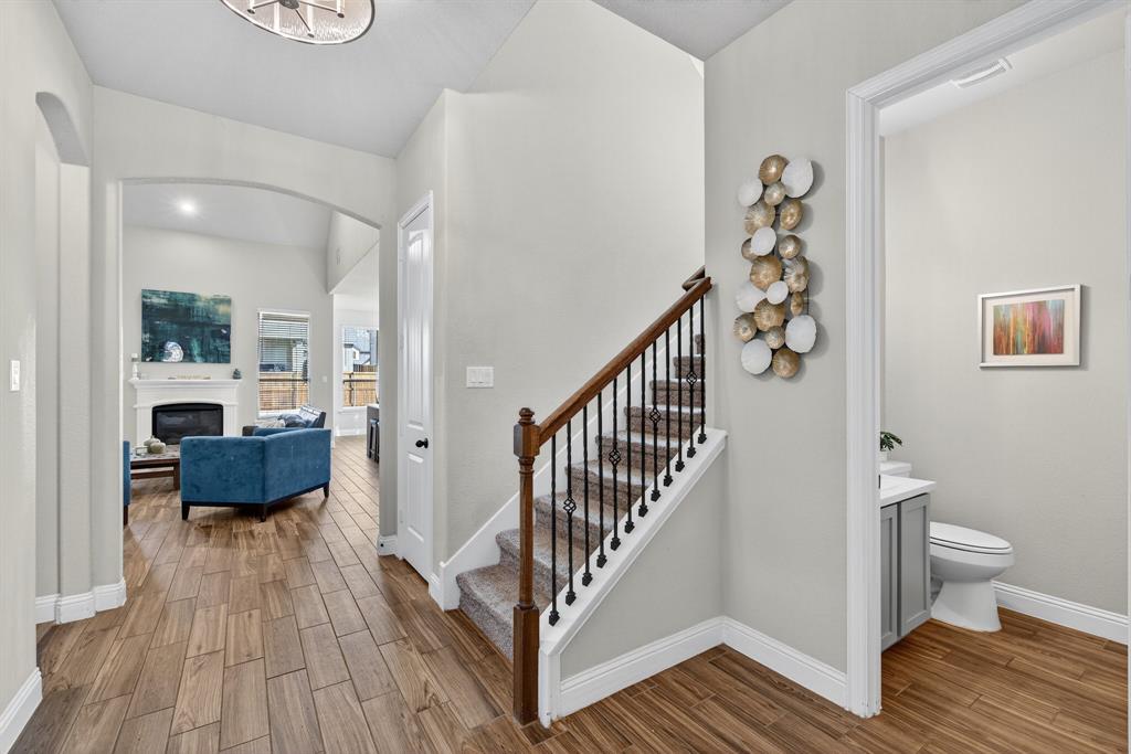 2815 Long Slope Road Arlington, TX 76001 - Photo 8 of 34 a view of a hallway with wooden floor and furniture