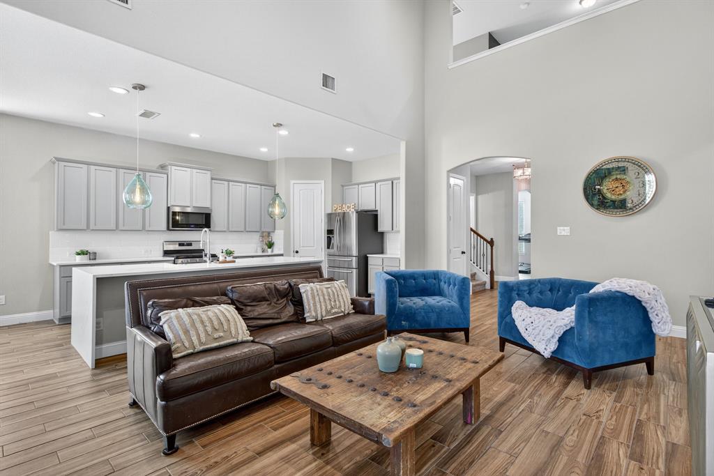 2815 Long Slope Road Arlington, TX 76001 - Photo 9 of 34 a living room with furniture and a wooden floor