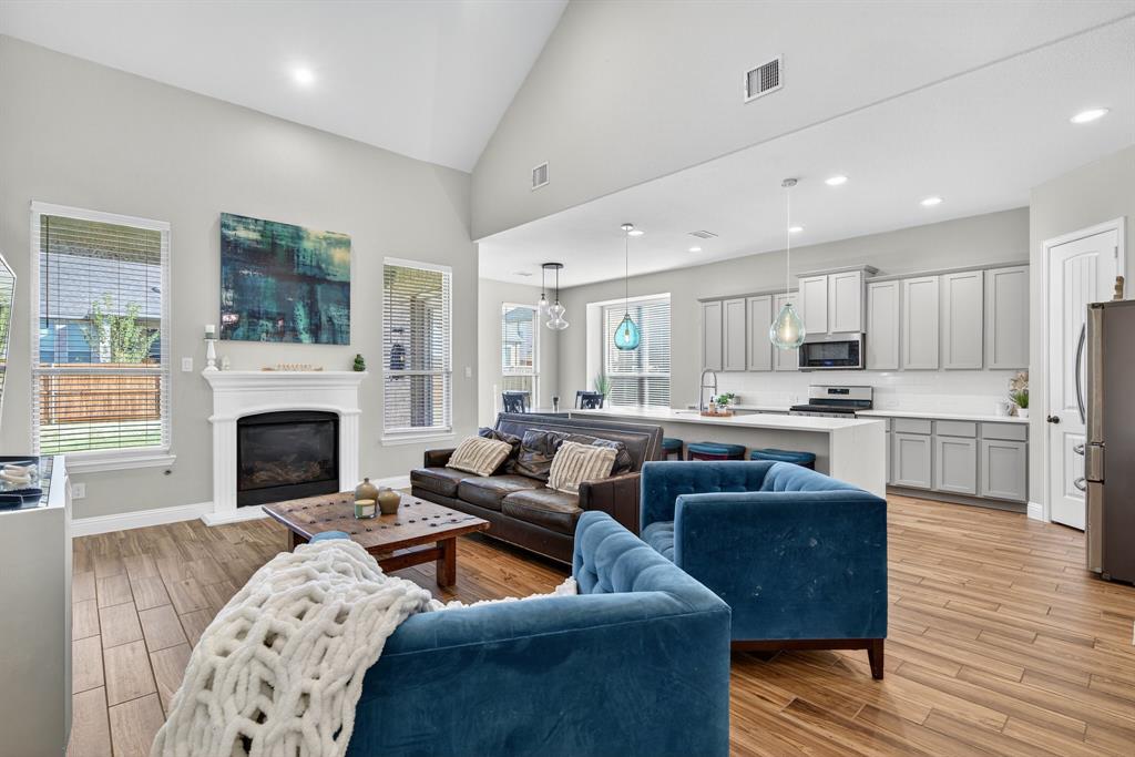 2815 Long Slope Road Arlington, TX 76001 - Photo 10 of 34 a living room with furniture and a fireplace