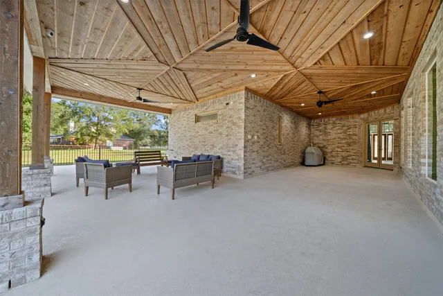 a view of a backyard with sitting area