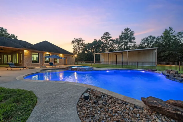 a view of an house with a yard and a garage
