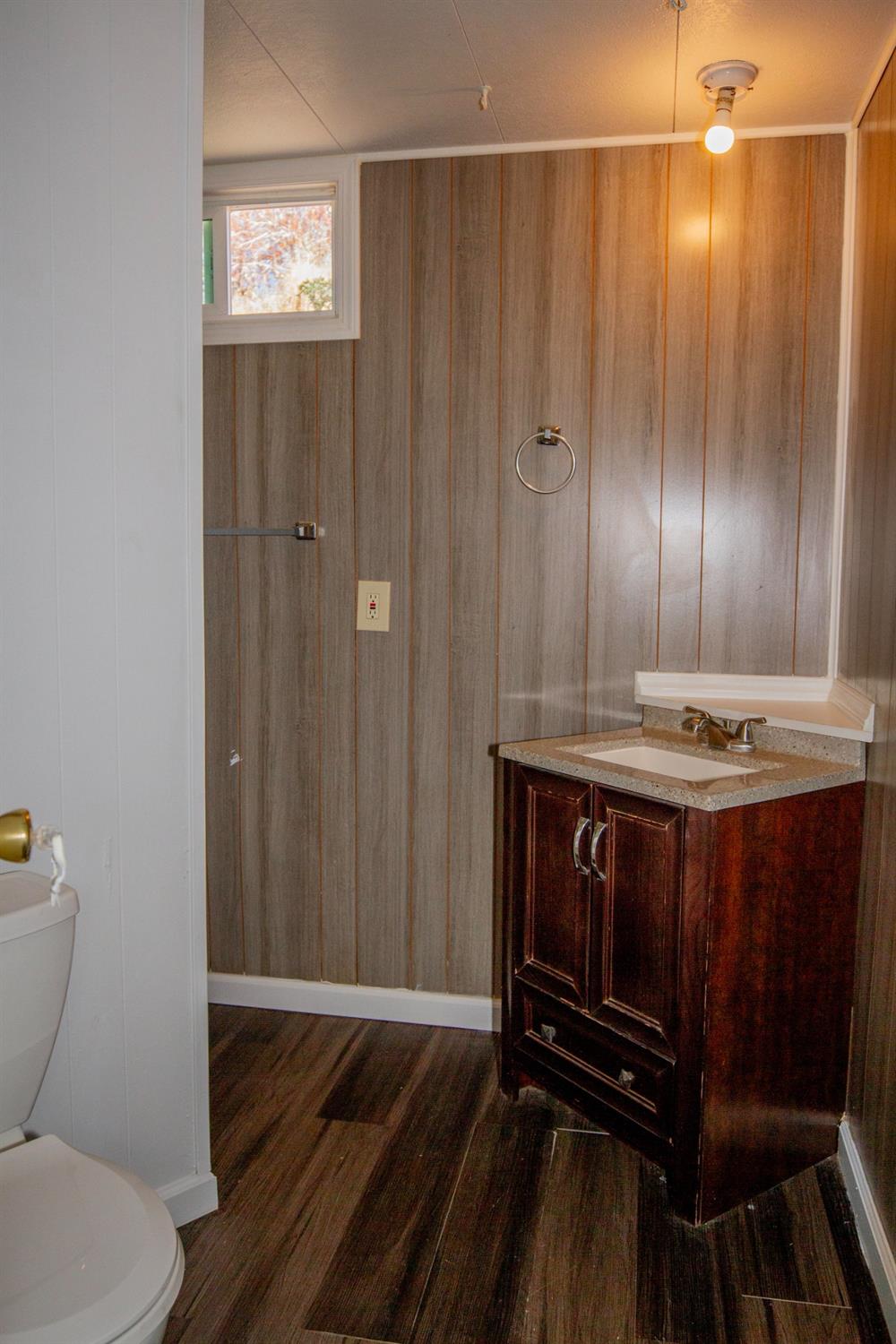 893 Winter Road Squaw Valley, CA 93675 - Photo 17 of 42 a view of bathroom with wooden floor and fan