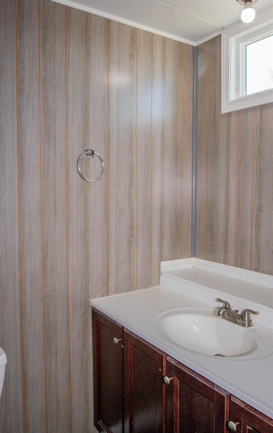 893 Winter Road Squaw Valley, CA 93675 - Photo 18 of 42 a bathroom with a sink and a mirror